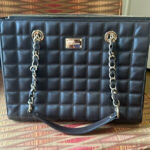 St John leather quilted luxury handbag in chocolate brown. 3 inside pockets.